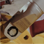 HNS Angle Head Nut Splitter on a flange nut within a confined space.